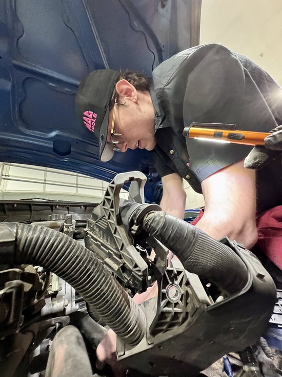 student working on engine