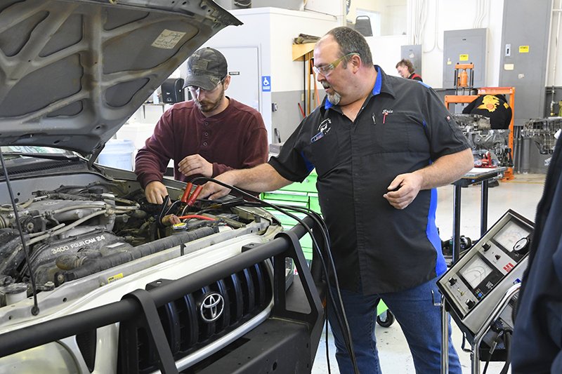 student working on engine
