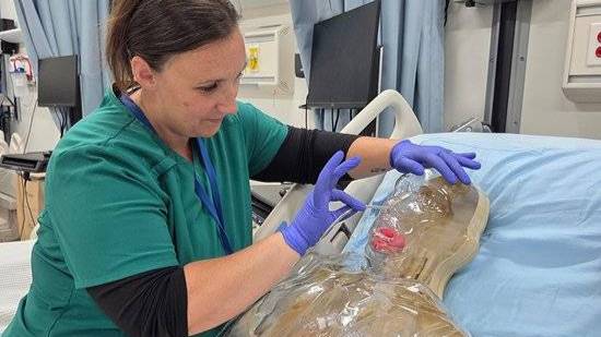 nurse working on dummy patient