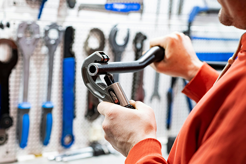 plumber bending pipe