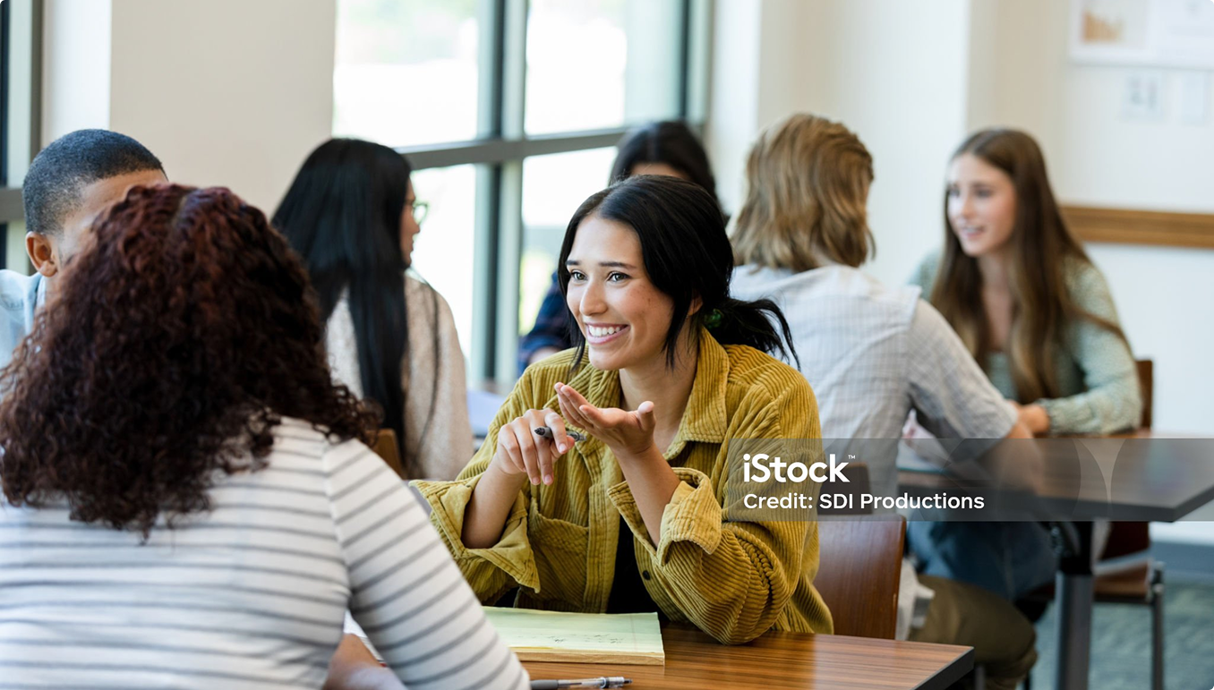 Student talking and smiling